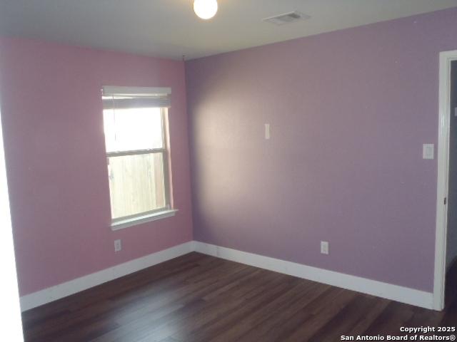 2690 Mccrae, New Braunfels, TX 78130 - spare room featuring baseboards and dark wood-style floors