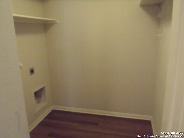 2690 Mccrae, New Braunfels, TX 78130 - laundry room featuring dark wood-style flooring and electric dryer hookup