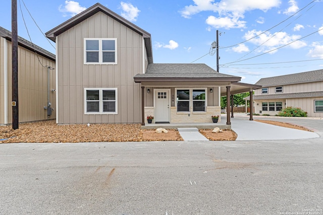 304 Riley Way, Kerrville, TX 78028 - view of front of house with driveway, roof with shingles, board and batten siding, and a carport