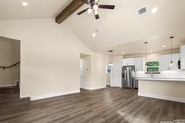 304 Riley Way, Kerrville, TX 78028 - unfurnished living room with ceiling fan, beamed ceiling, dark wood-style floors, high vaulted ceiling, and recessed lighting