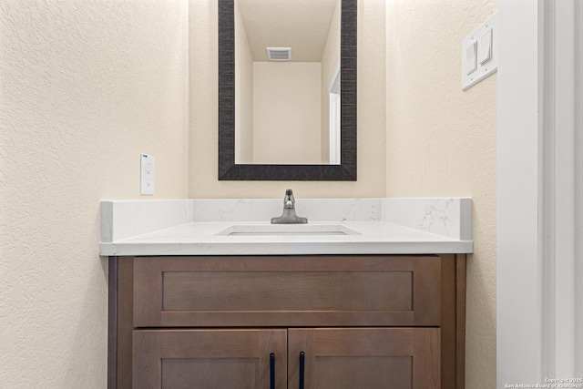 304 Riley Way, Kerrville, TX 78028 - bathroom with a textured wall and vanity