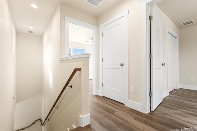 304 Riley Way, Kerrville, TX 78028 - corridor with an upstairs landing, wood finished floors, and recessed lighting