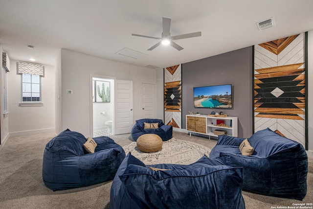270 Lily Pass, Castroville, TX 78009 - carpeted living area with ceiling fan and an accent wall