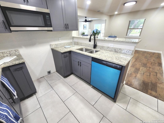 102 Wonder, San Antonio, TX 78213 - kitchen with dishwasher, stainless steel microwave, a peninsula, light stone countertops, and recessed lighting