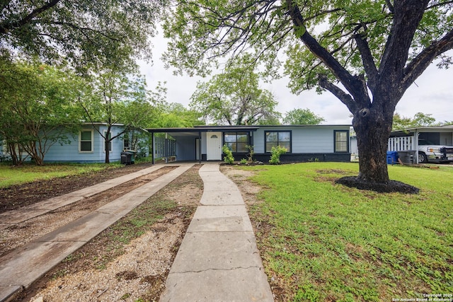 251 Serna, San Antonio, TX 78218 - ranch-style house with concrete driveway, a front yard, and a carport
