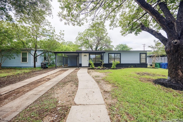 251 Serna, San Antonio, TX 78218 - single story home with concrete driveway, a front yard, and an attached carport