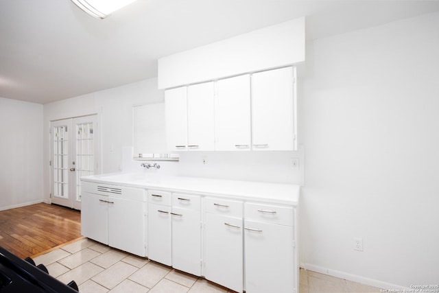 251 Serna, San Antonio, TX 78218 - kitchen featuring light countertops, white cabinetry, and french doors