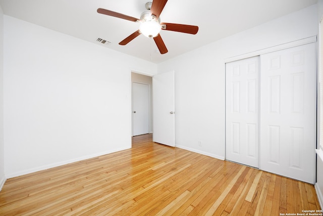 251 Serna, San Antonio, TX 78218 - unfurnished bedroom with light wood-type flooring, a closet, and ceiling fan