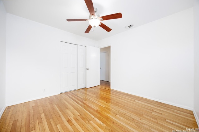 251 Serna, San Antonio, TX 78218 - unfurnished bedroom with light wood-style flooring, a closet, and ceiling fan