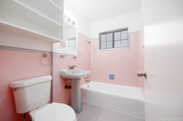 251 Serna, San Antonio, TX 78218 - bathroom with tile walls, shower / tub combination, and healthy amount of natural light