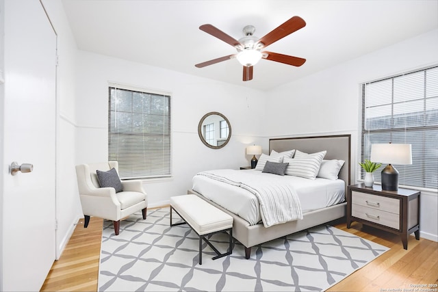 251 Serna, San Antonio, TX 78218 - bedroom featuring light wood-style flooring, multiple windows, and a ceiling fan