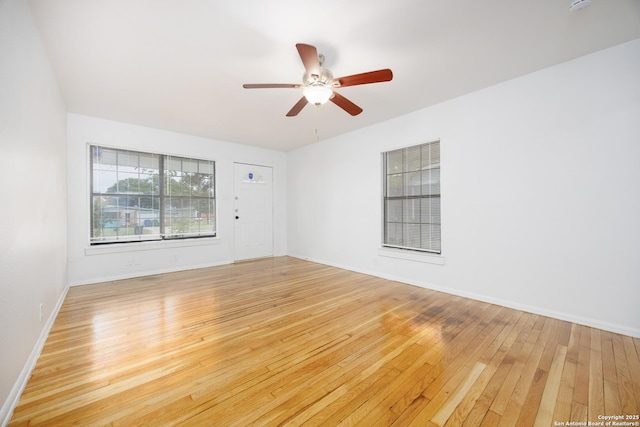 251 Serna, San Antonio, TX 78218 - empty room featuring light wood-style flooring, ceiling fan, and a smoke detector
