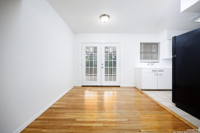 251 Serna, San Antonio, TX 78218 - unfurnished dining area featuring light wood-style flooring and french doors