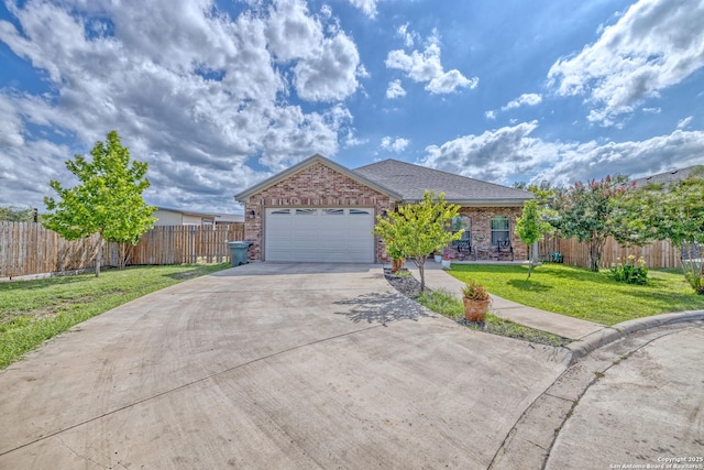 104 Sunday Ct, Uvalde, TX 78801 - single story home with driveway, brick siding, and a garage