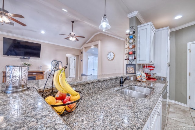 104 Sunday Ct, Uvalde, TX 78801 - kitchen with a ceiling fan, white cabinetry, stone counters, recessed lighting, and open floor plan