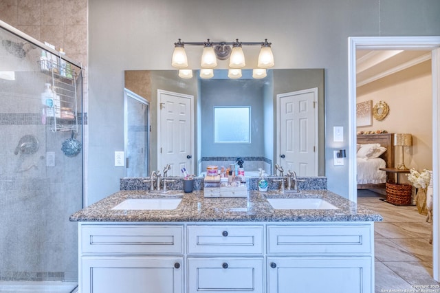 104 Sunday Ct, Uvalde, TX 78801 - bathroom with ensuite bath, a stall shower, and double vanity
