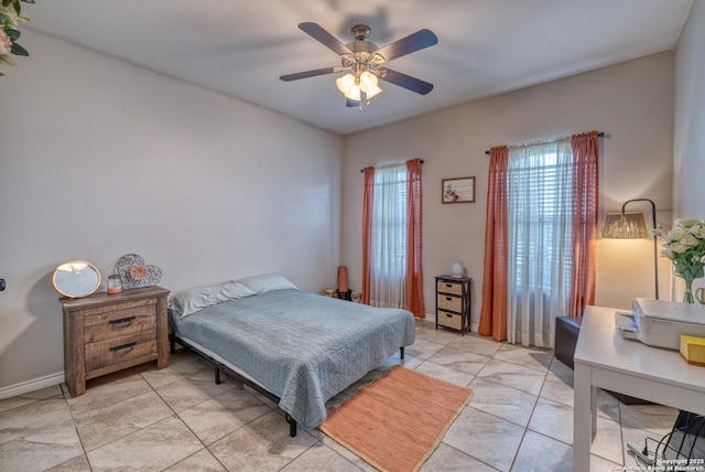 104 Sunday Ct, Uvalde, TX 78801 - bedroom featuring light tile patterned floors and a ceiling fan