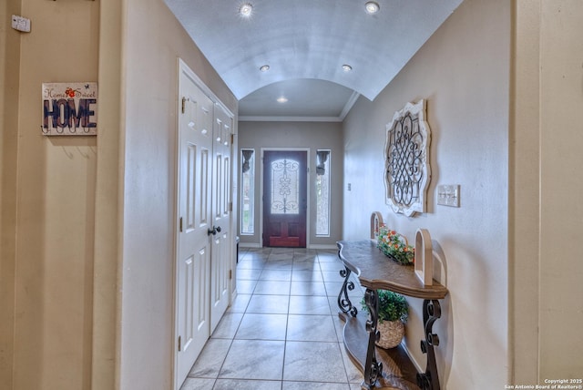 104 Sunday Ct, Uvalde, TX 78801 - entryway featuring crown molding, light tile patterned floors, and lofted ceiling