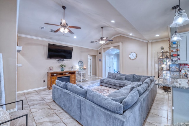 104 Sunday Ct, Uvalde, TX 78801 - living area with arched walkways, ceiling fan, vaulted ceiling, crown molding, and recessed lighting
