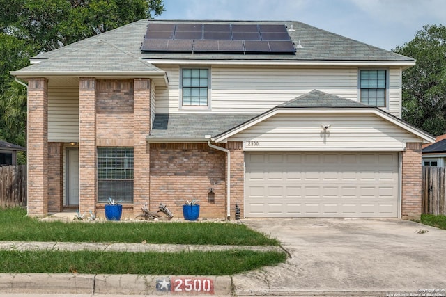 2500 Newning, Schertz, TX 78154 - view of front of property with brick siding, solar panels, driveway, and a shingled roof