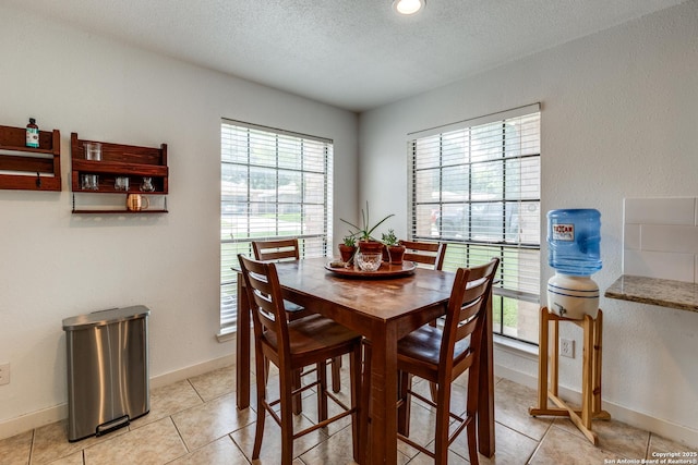 2500 Newning, Schertz, TX 78154 - dining space featuring a textured ceiling and light tile patterned flooring