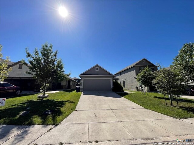 2092 Brandywine, New Braunfels, TX 78130 - view of front facade with concrete driveway, a front yard, and a garage