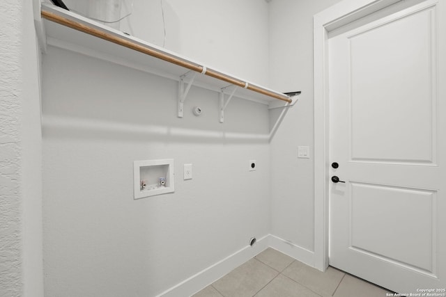 10706 Pharaoh Run, San Antonio, TX 78254 - washroom with hookup for an electric dryer, light tile patterned floors, and hookup for a washing machine