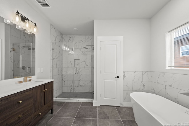 10706 Pharaoh Run, San Antonio, TX 78254 - full bath featuring a soaking tub, a marble finish shower, vanity, and tile patterned floors