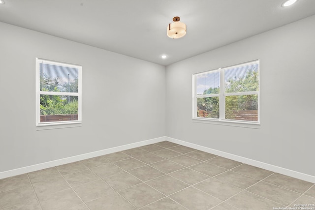 10706 Pharaoh Run, San Antonio, TX 78254 - unfurnished room featuring healthy amount of natural light, light tile patterned flooring, and recessed lighting