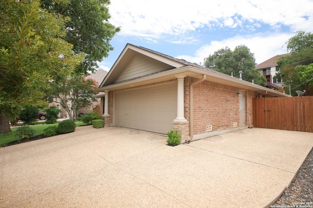 14630 Snip, San Antonio, TX 78248 - view of side of property featuring brick siding and concrete driveway