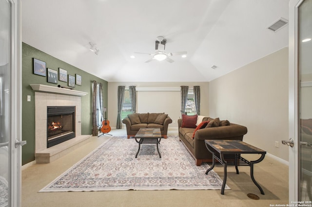 14630 Snip, San Antonio, TX 78248 - carpeted living area with a ceiling fan, lofted ceiling, and a tile fireplace