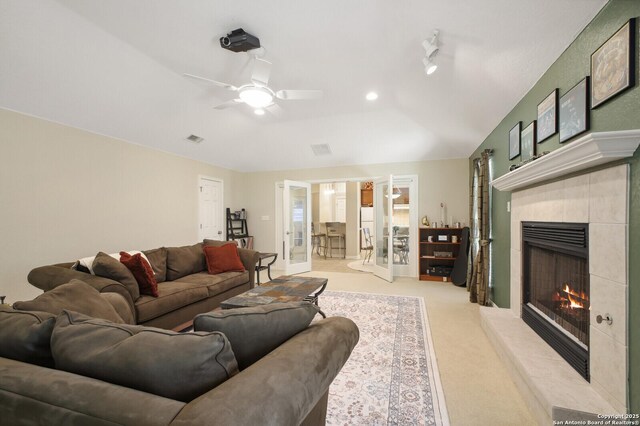 14630 Snip, San Antonio, TX 78248 - living area with a tiled fireplace, a ceiling fan, and carpet floors