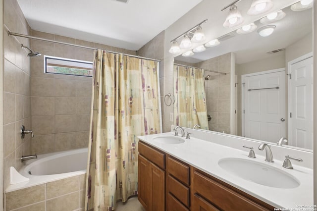 14630 Snip, San Antonio, TX 78248 - bathroom featuring tiled shower / bath combo and double vanity