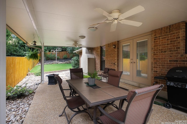 14630 Snip, San Antonio, TX 78248 - fenced backyard with french doors, a ceiling fan, outdoor dining area, grilling area, and a patio