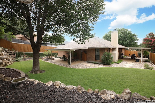 14630 Snip, San Antonio, TX 78248 - rear view of house with a patio area, a chimney, brick siding, and a shingled roof