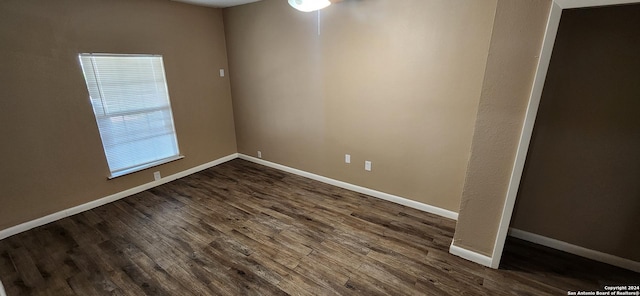 1826 Laven Dr, San Antonio, TX 78228 - unfurnished room featuring baseboards and dark wood-style floors