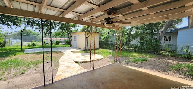 1826 Laven Dr, San Antonio, TX 78228 - fenced backyard with a patio area, ceiling fan, and a storage shed