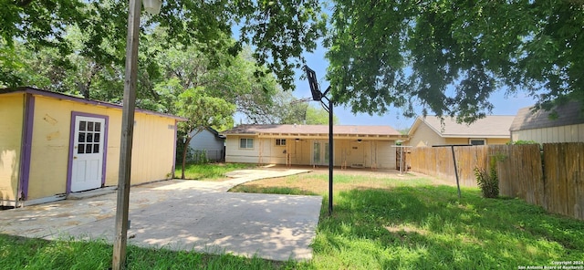 1826 Laven Dr, San Antonio, TX 78228 - fenced backyard featuring a patio area and an outbuilding