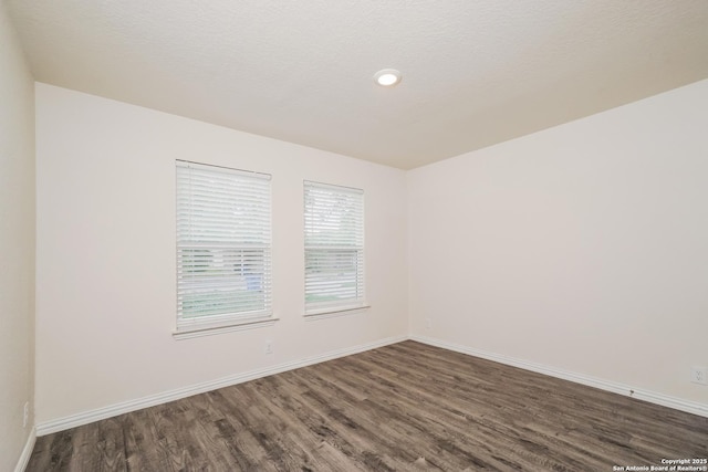 223 Baxter, Seguin, TX 78155 - spare room with dark wood-style flooring