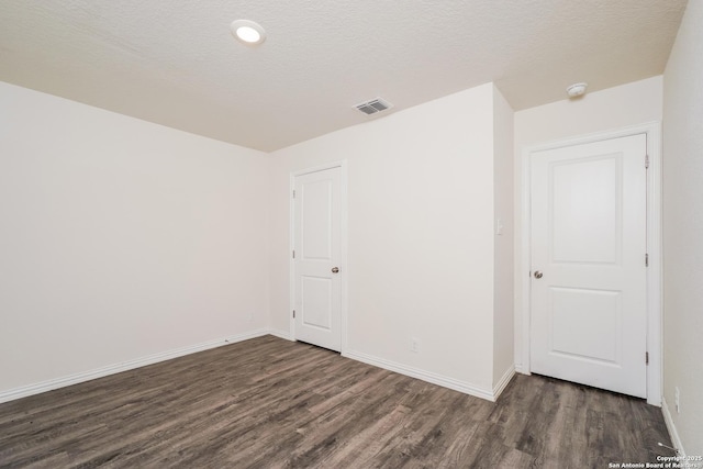 223 Baxter, Seguin, TX 78155 - empty room featuring wood finished floors and a smoke detector