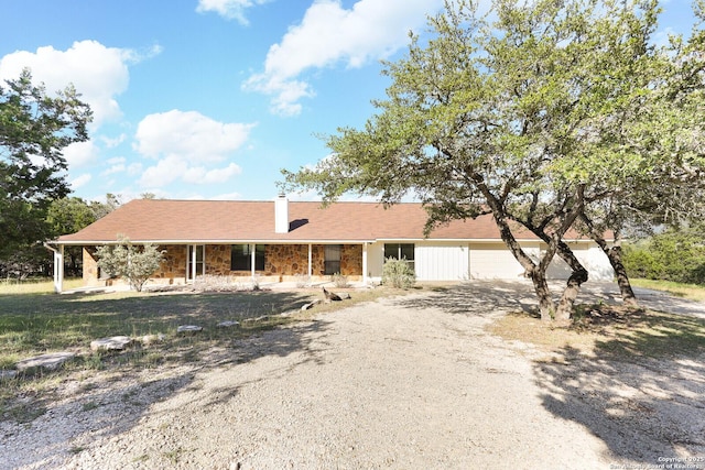 540 Soft Wind, Canyon Lake, TX 78133 - view of front of property with covered porch and driveway