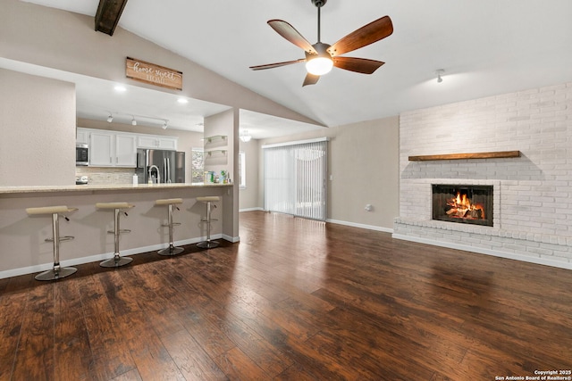 5811 Lake Chap, San Antonio, TX 78222 - living area featuring ceiling fan, a fireplace, and wood-type flooring