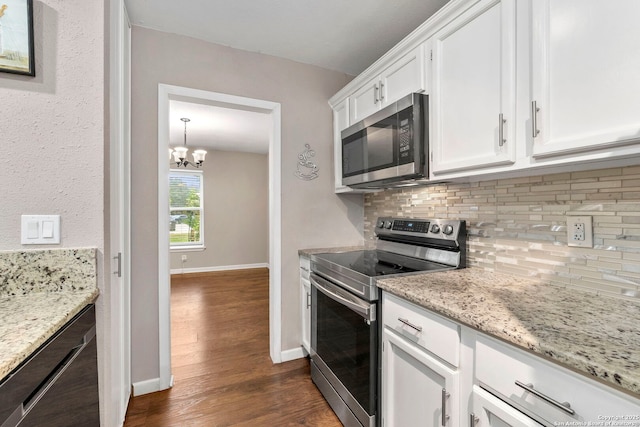 5811 Lake Chap, San Antonio, TX 78222 - kitchen with appliances with stainless steel finishes, tasteful backsplash, white cabinetry, and dark wood finished floors