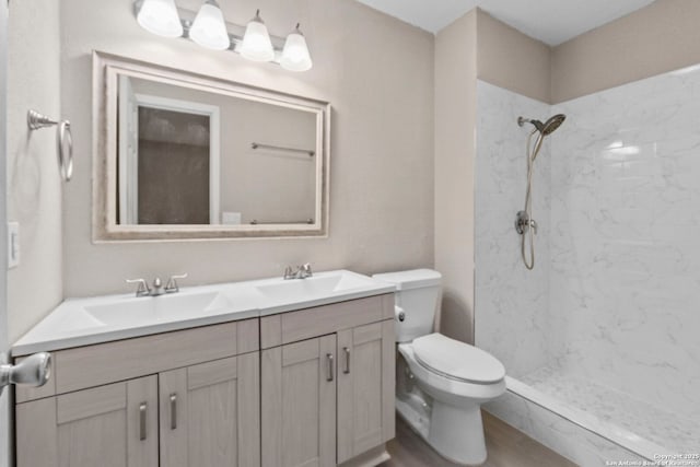 5811 Lake Chap, San Antonio, TX 78222 - bathroom with double vanity, a marble finish shower, and wood finished floors
