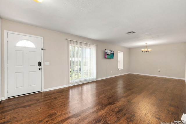 5811 Lake Chap, San Antonio, TX 78222 - entryway with a chandelier and dark wood-style floors