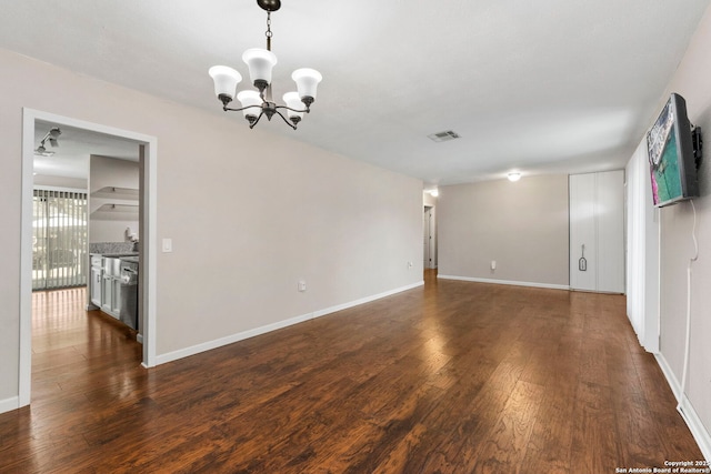 5811 Lake Chap, San Antonio, TX 78222 - unfurnished room with a chandelier and dark wood-style flooring