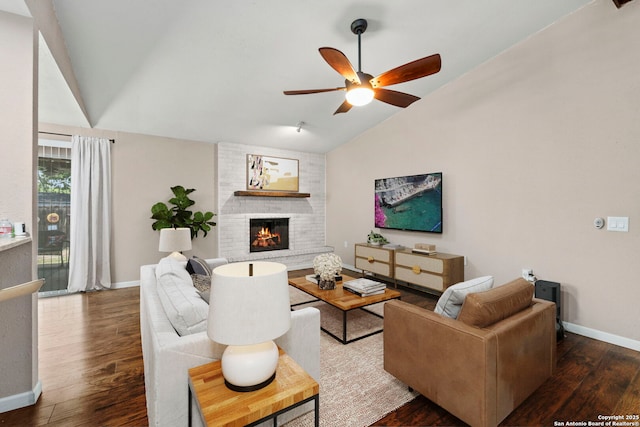 5811 Lake Chap, San Antonio, TX 78222 - living area featuring vaulted ceiling, a ceiling fan, wood finished floors, and a fireplace