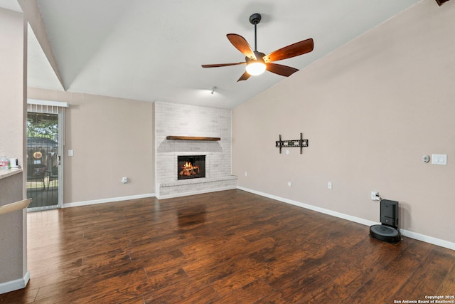 5811 Lake Chap, San Antonio, TX 78222 - unfurnished living room with vaulted ceiling, ceiling fan, wood finished floors, and a fireplace