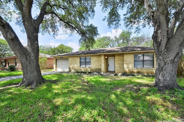 105 Apache, Cibolo, TX 78108 - ranch-style home with a garage, brick siding, driveway, and a front yard