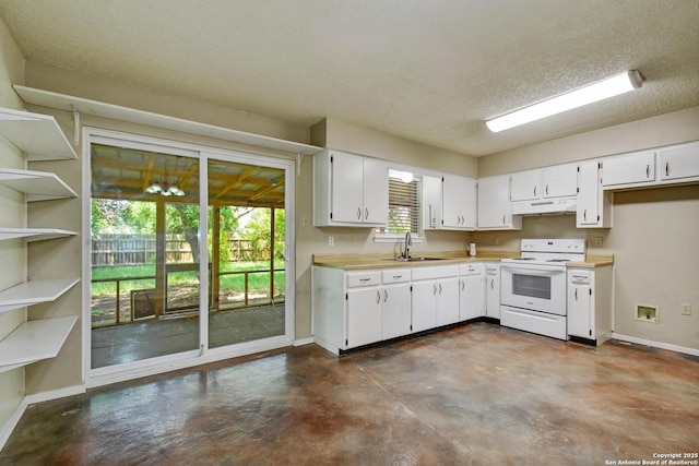 105 Apache, Cibolo, TX 78108 - kitchen with white range with electric stovetop, under cabinet range hood, concrete floors, white cabinets, and light countertops